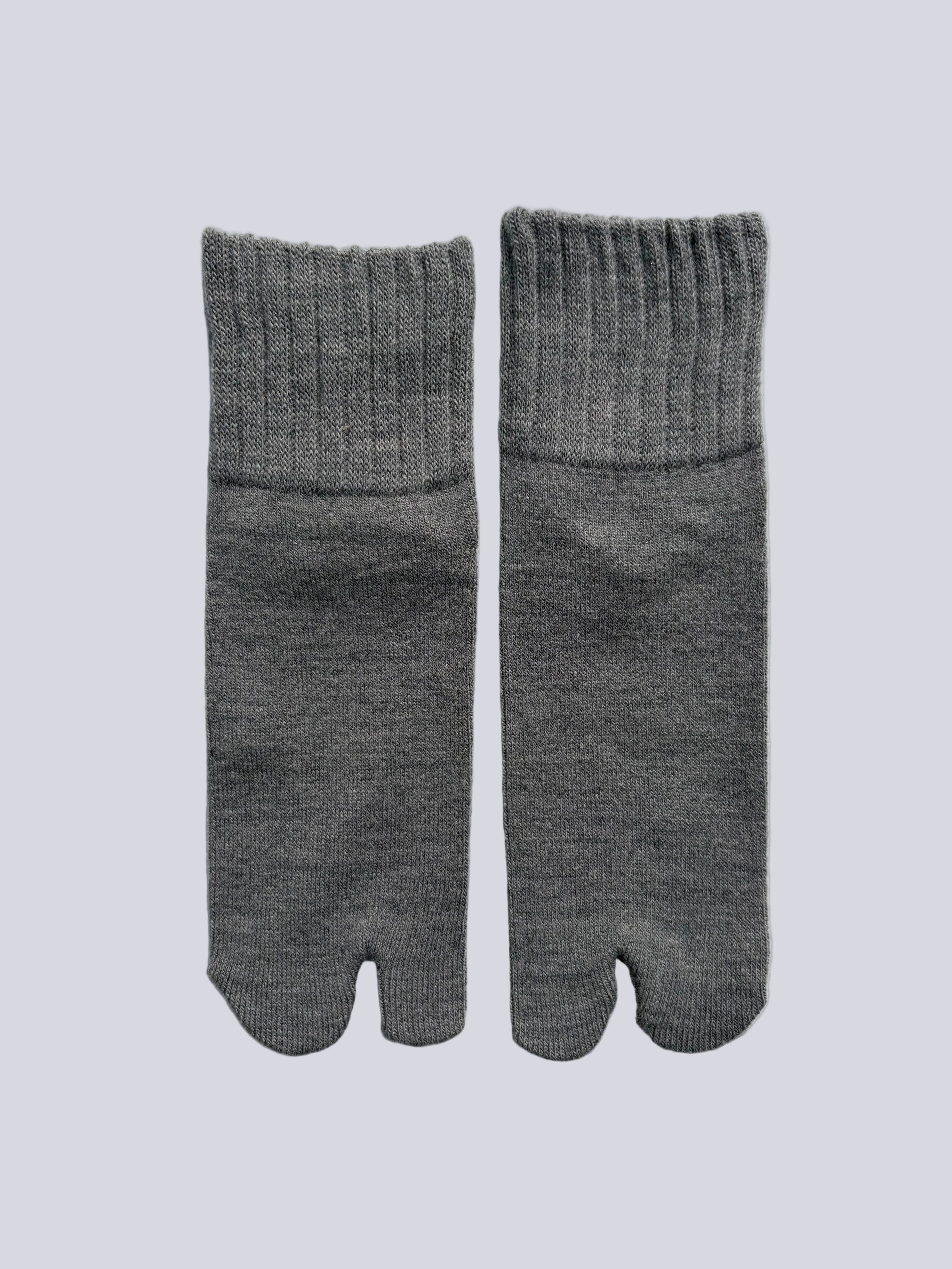Flat lay  of light grey ankle length grey wool warm knit Japanese tabi socks 