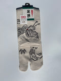 Cream Tabi sock with crane, turtle and leaf design on a light gray background