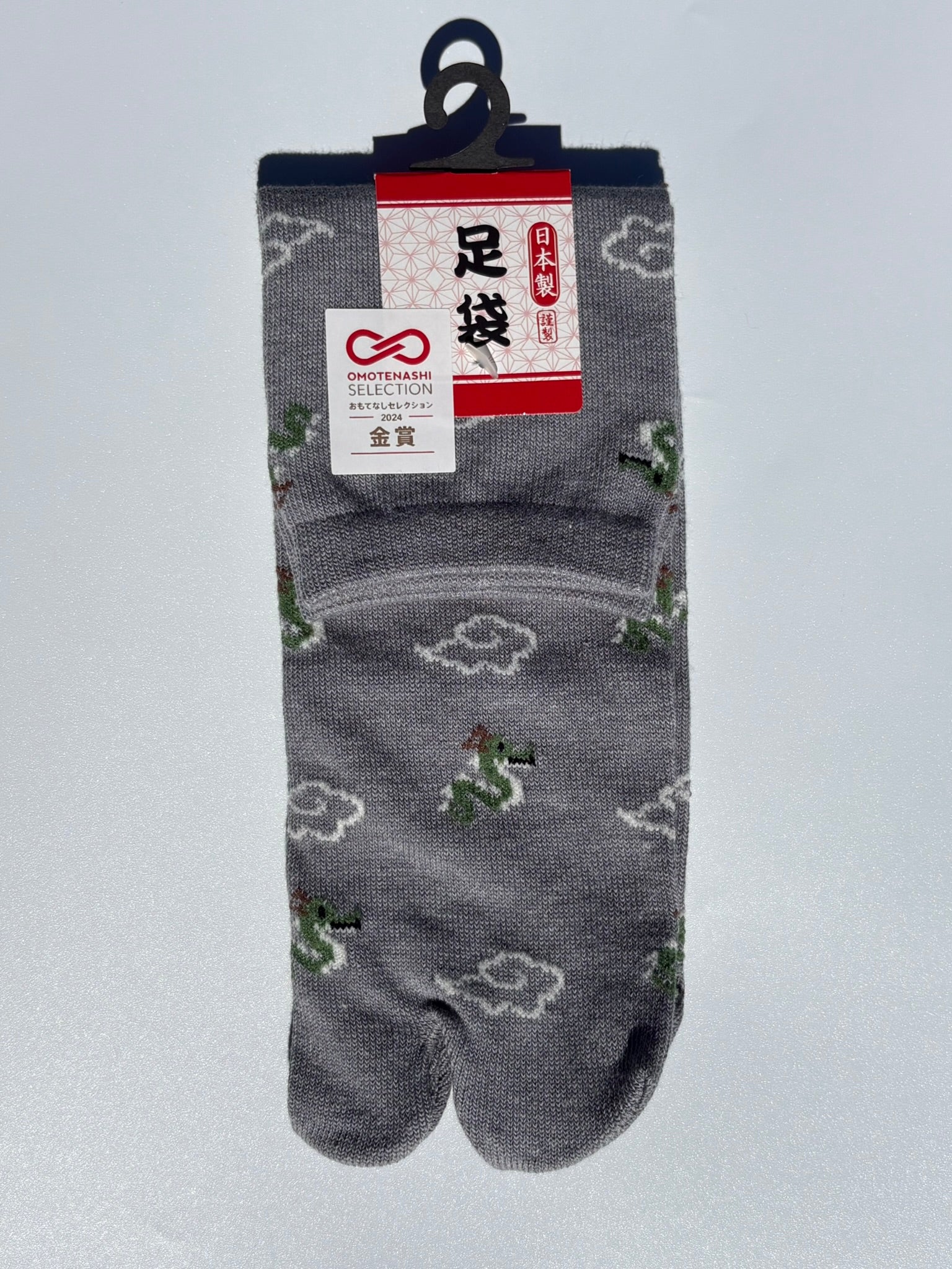 grey pair of beige dragon and clouds print tabi socks made in japan premium cotton quality lay flat on white background