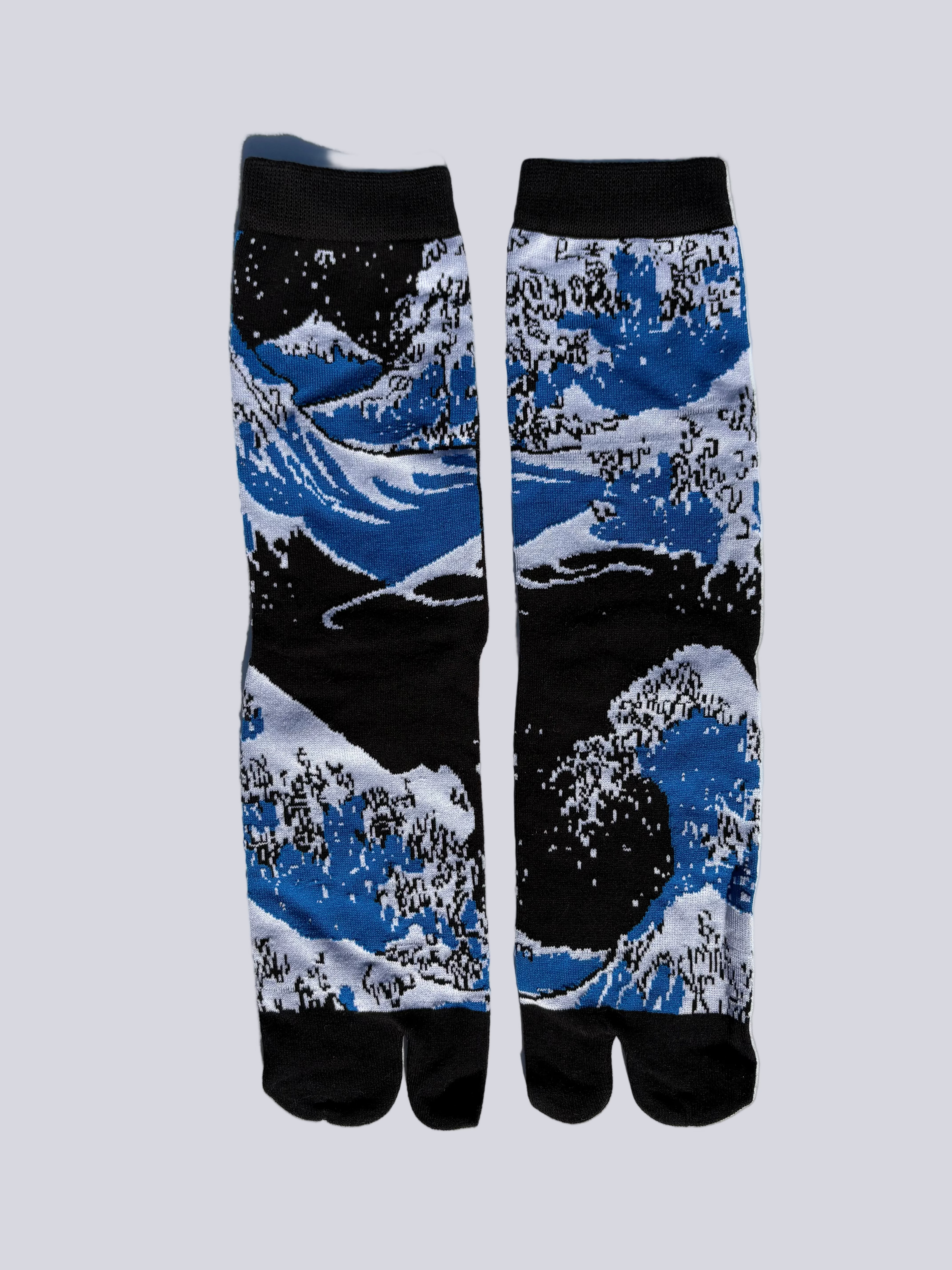 Black tabi split-toe socks with full allover Hokusai Great Wave off Kanagawa print in blue and white — Japanese ukiyo-e art tabi socks made of cotton