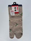 pair of beige dragon and clouds print tabi socks made in japan premium cotton quality lay flat on white background