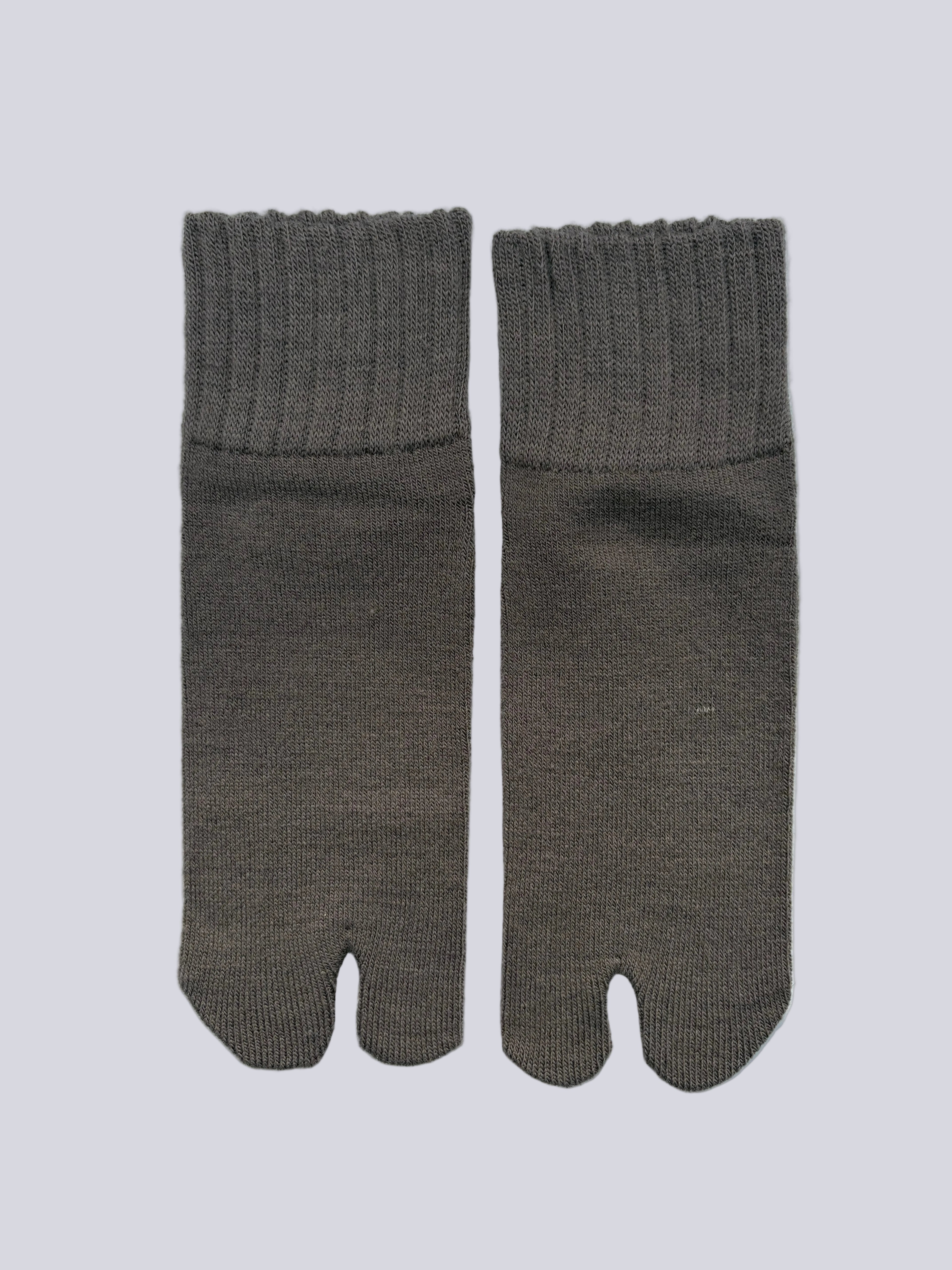 Flat lay  of ankle length grey wool warm knit Japanese tabi socks 