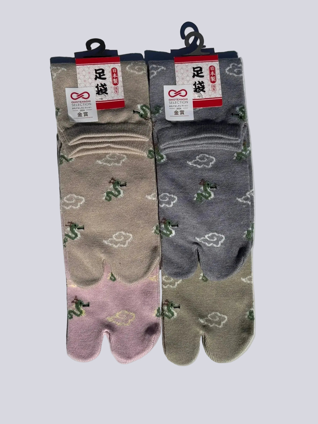 four pairs of dragon and clouds print tabi socks made in japan premium cotton quality lay flat on white background