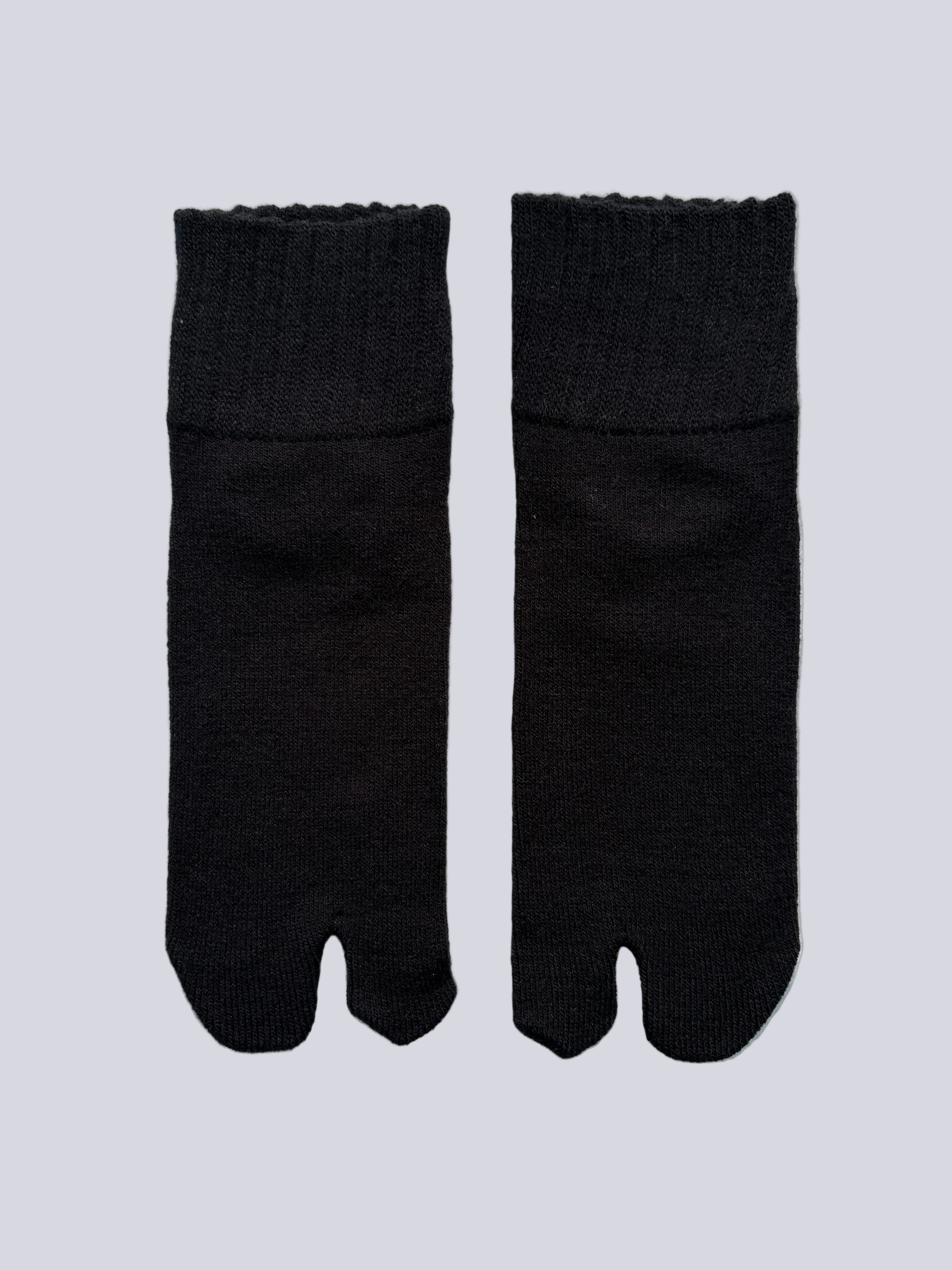 Flat lay  of black ankle length grey wool warm knit Japanese tabi socks 