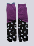 Colour-block tabi split-toe socks with solid purple upper and black lower with white floral motif print — Japanese fashion tabi socks