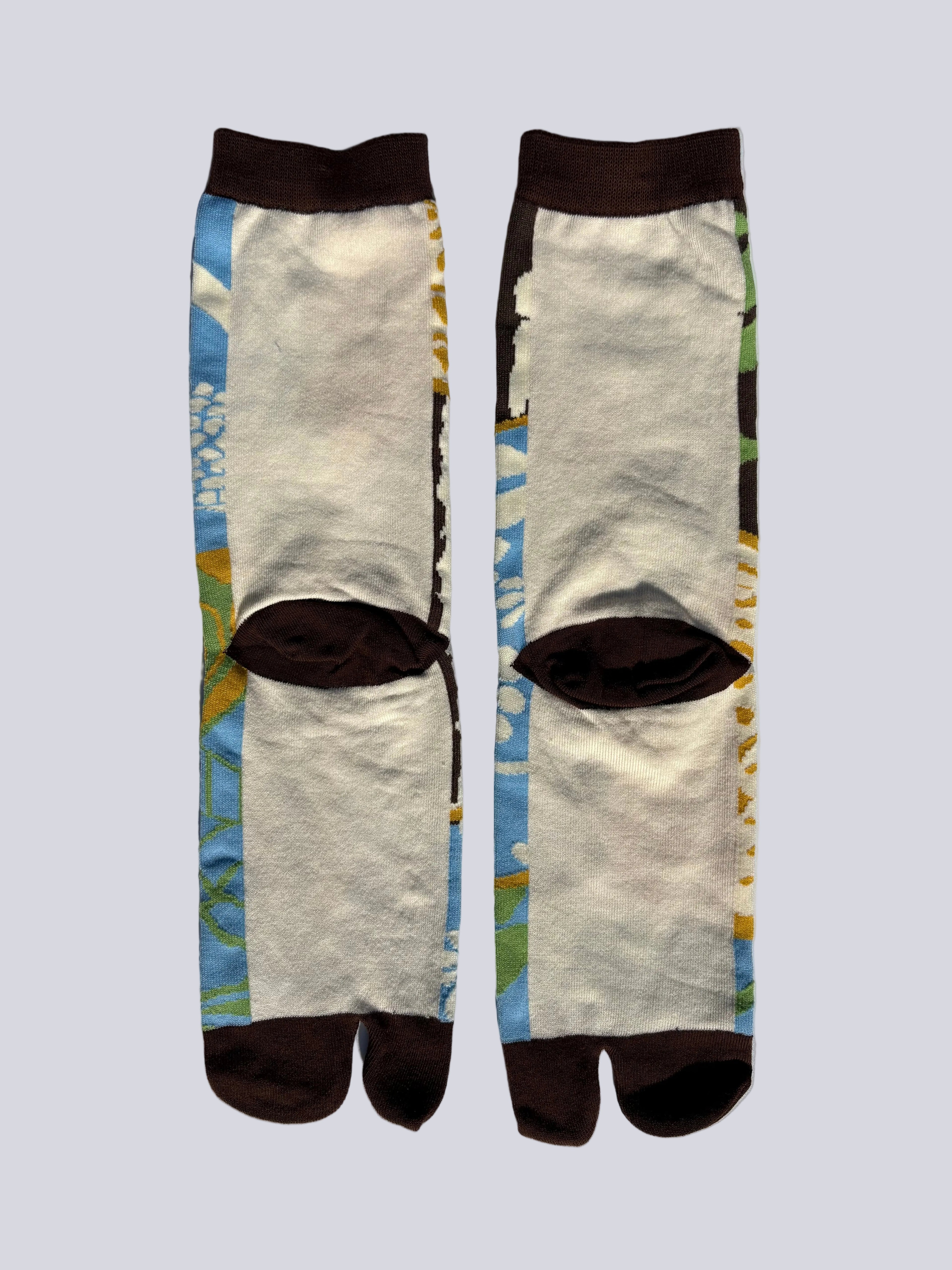 back Pair of tabi socks with a design on a gray background