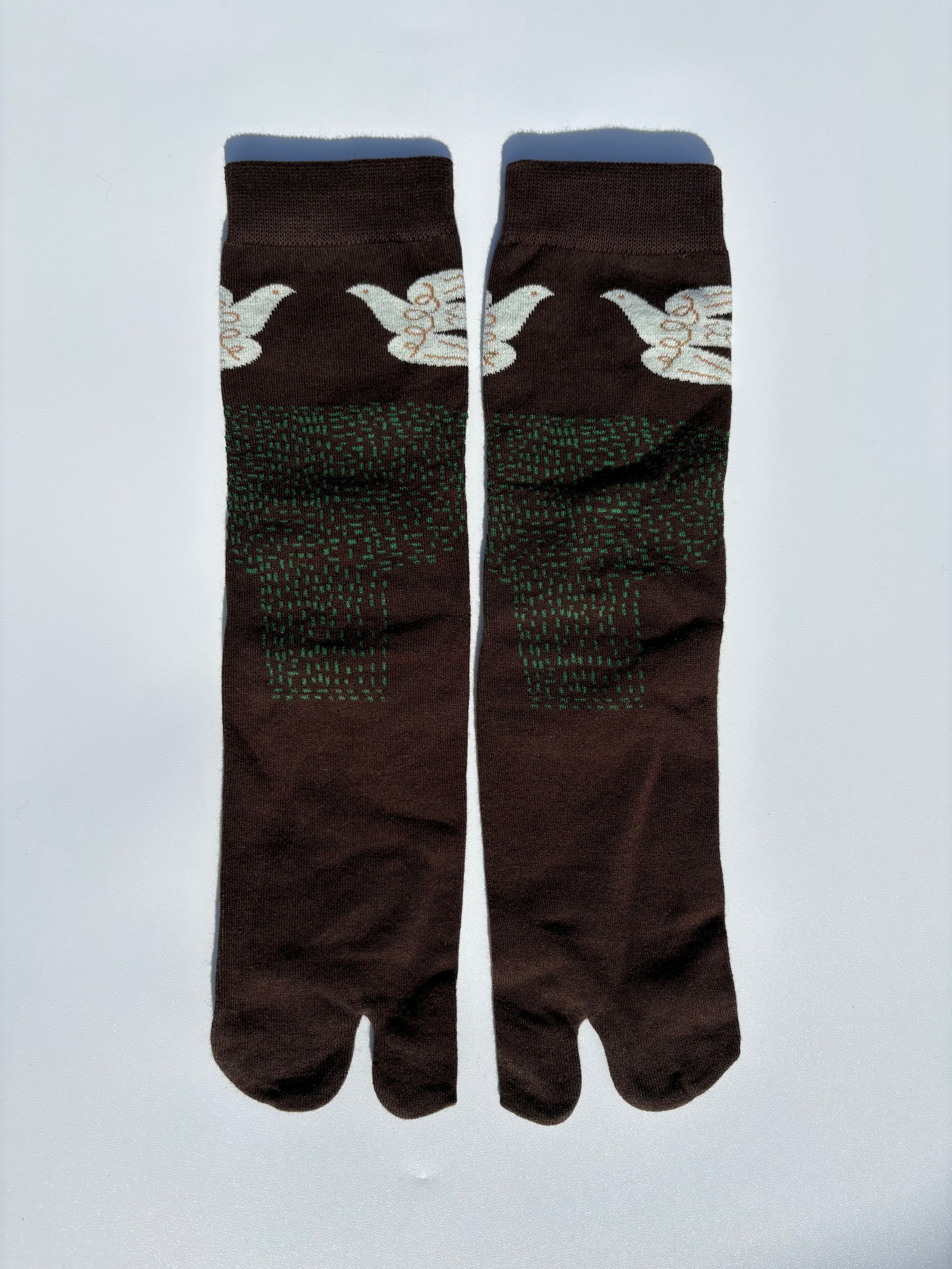 Pair of brown white dove birds print tabi socks flying over a brown field on a light gray background made of cotton material made for wearing tabi shoes