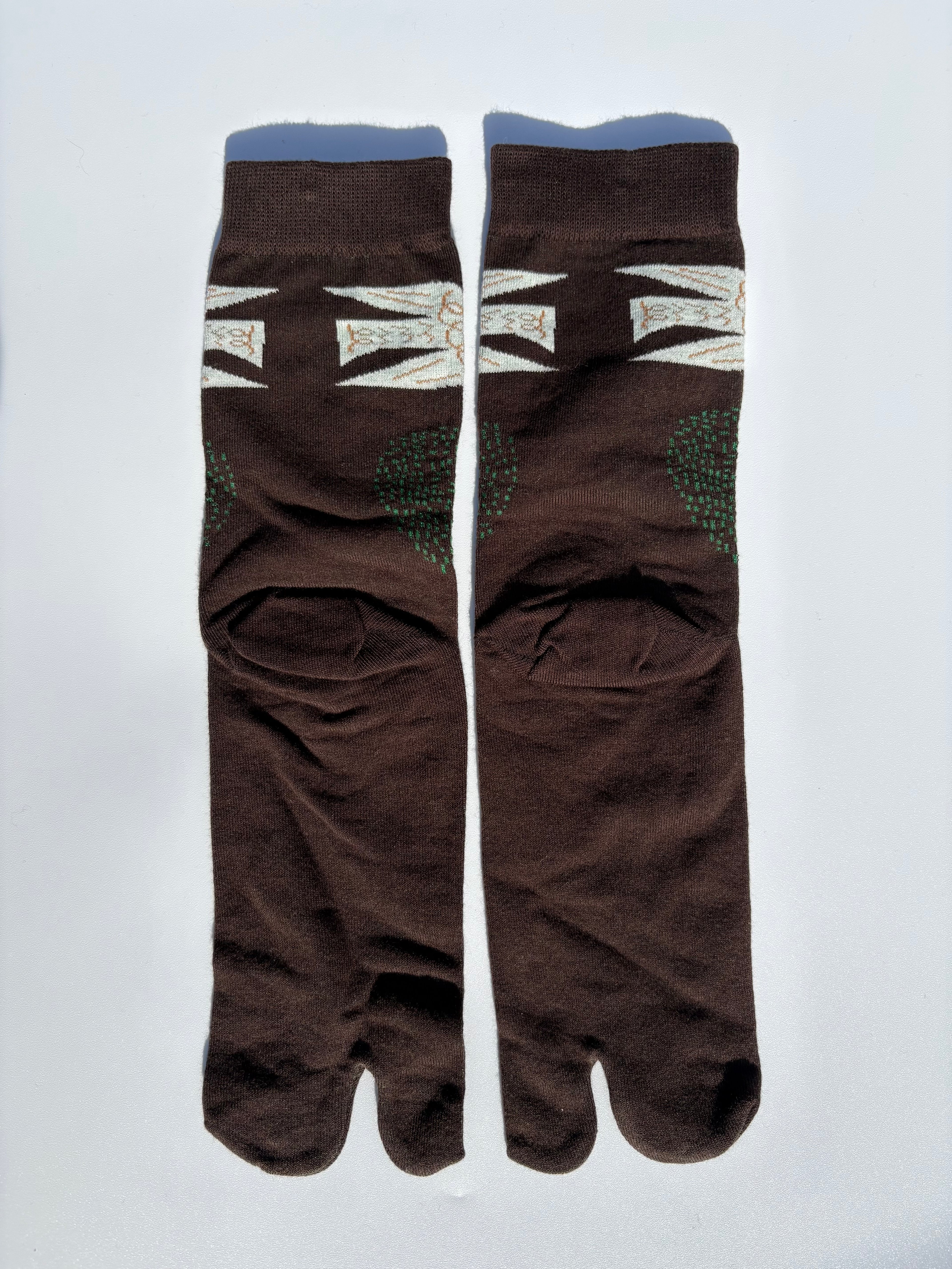 back of Pair of brown white dove birds print tabi socks flying over a brown field on a light gray background made of cotton material made for wearing tabi shoes