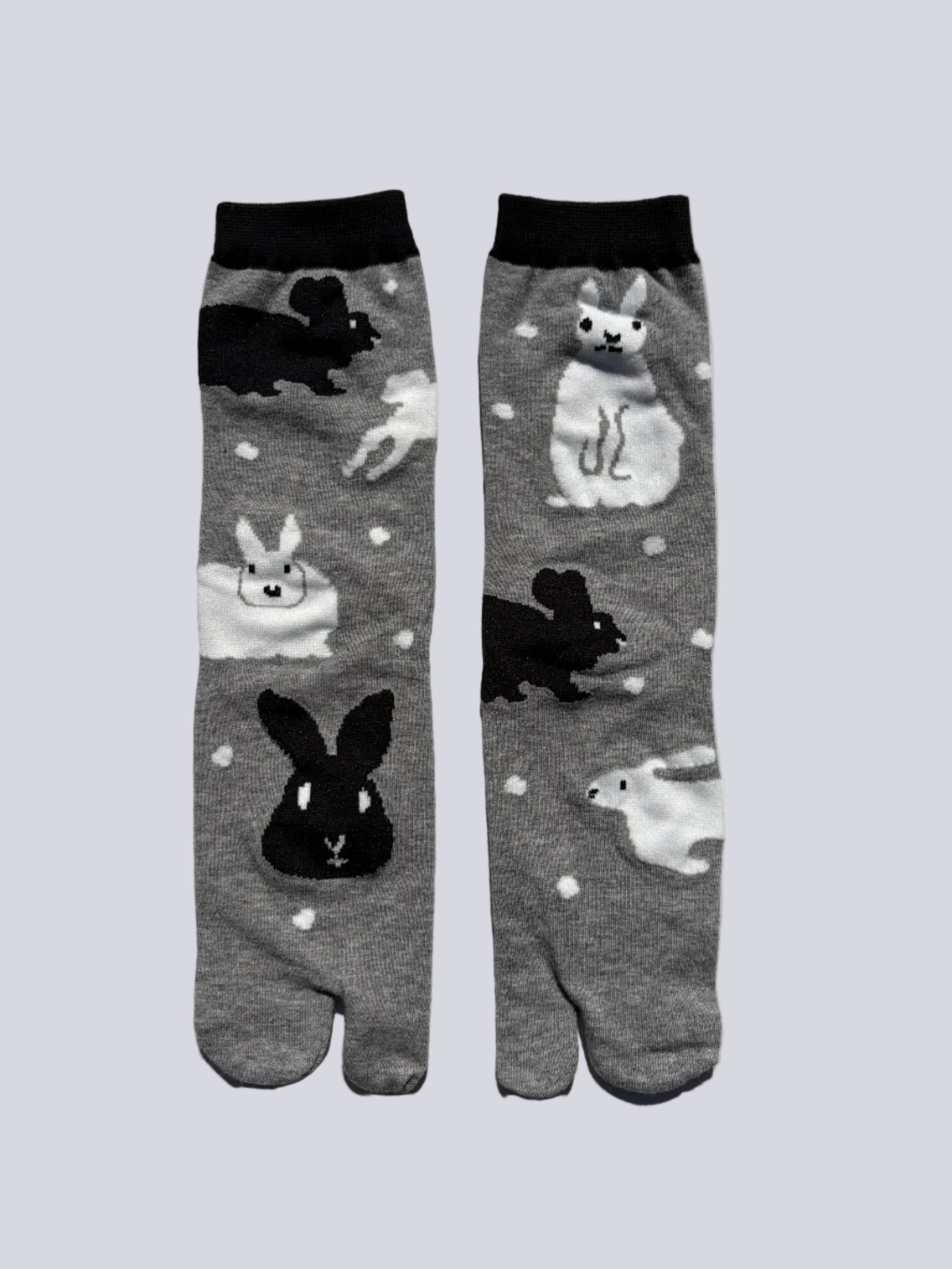 back of grey tabi socks with rabbit print on - japanese split toe design made of cotton - flat lay on white background