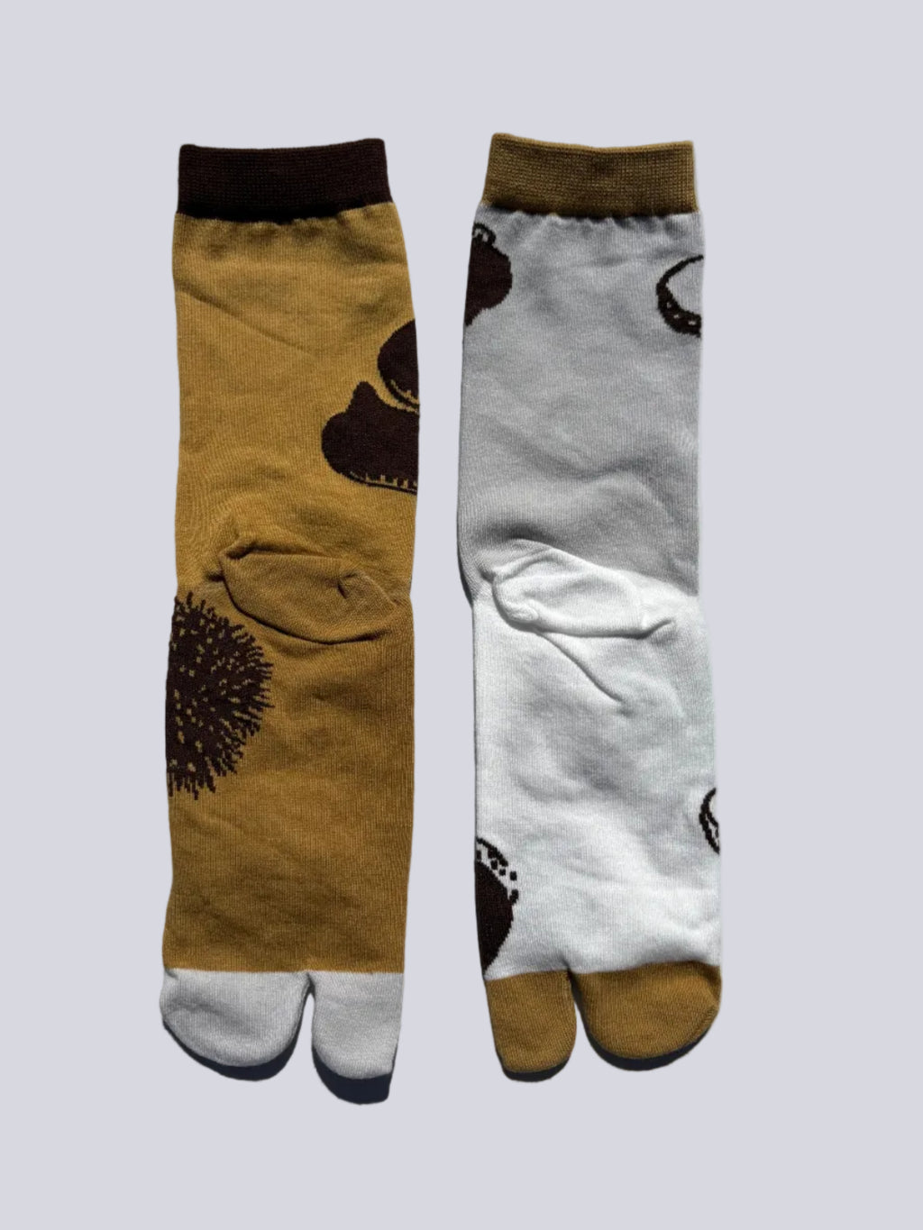back og tan and white chestnut print tabi socks - japanese split toe design made of cotton - flat lay on white background