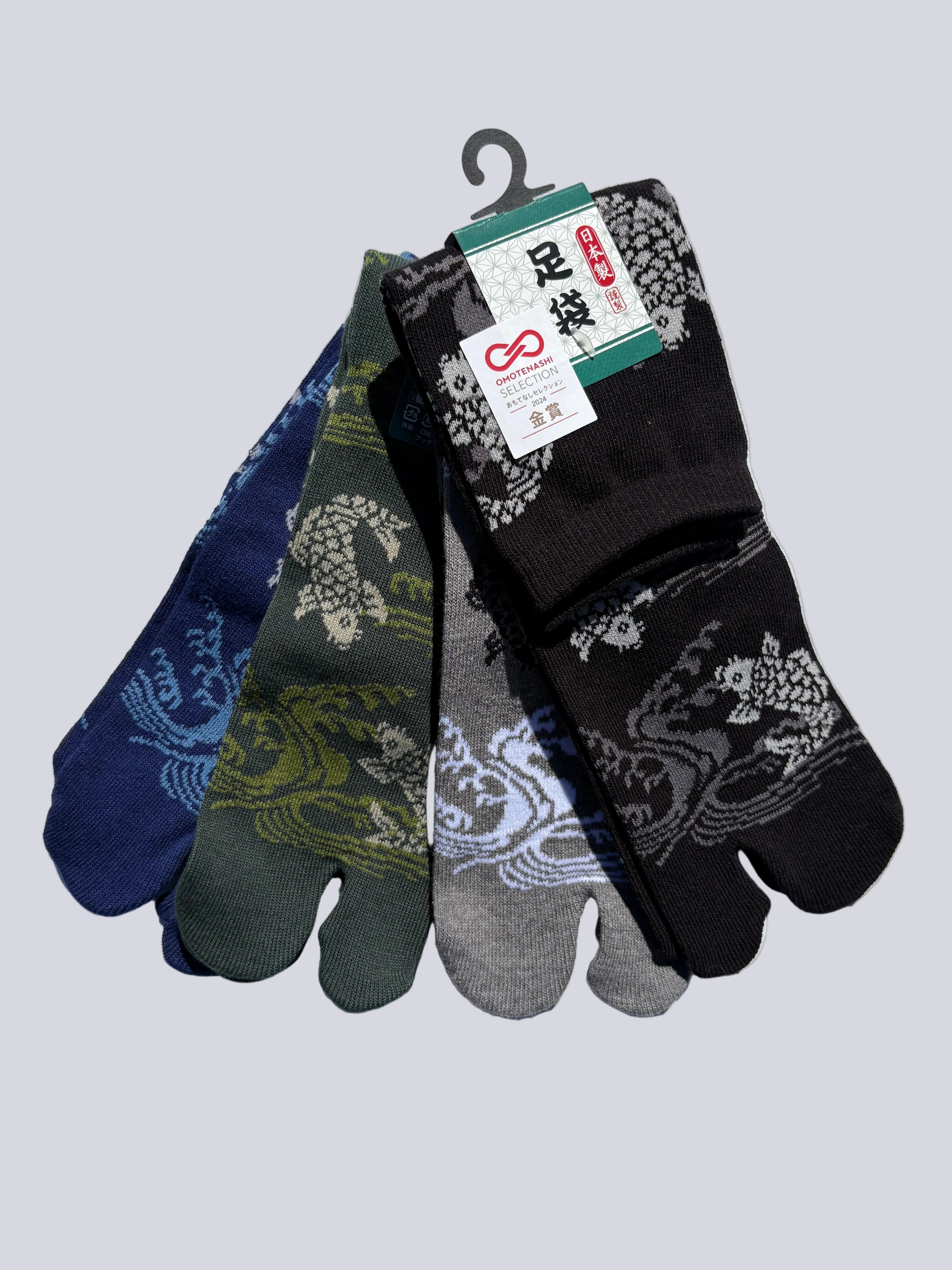 Set of four pairs of patterned koi fish traditional japanese tabi socks socks on a white background