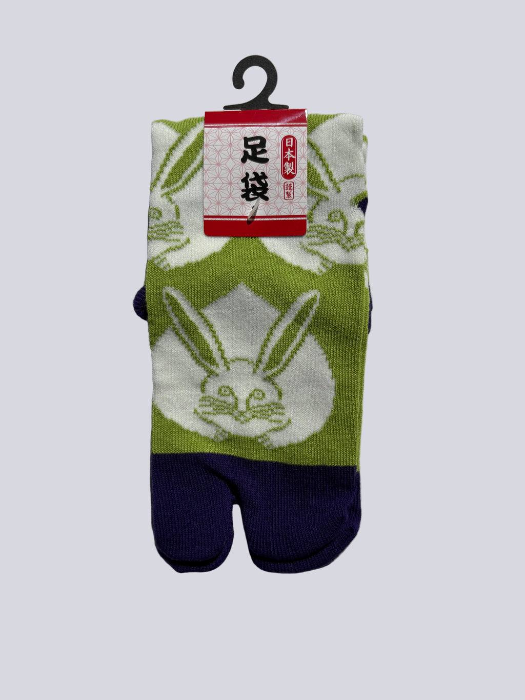 Green and white tabi split-toe socks with large Japanese rabbit (usagi) print and purple toe — Japanese-made novelty bunny tabi socks (足袋)