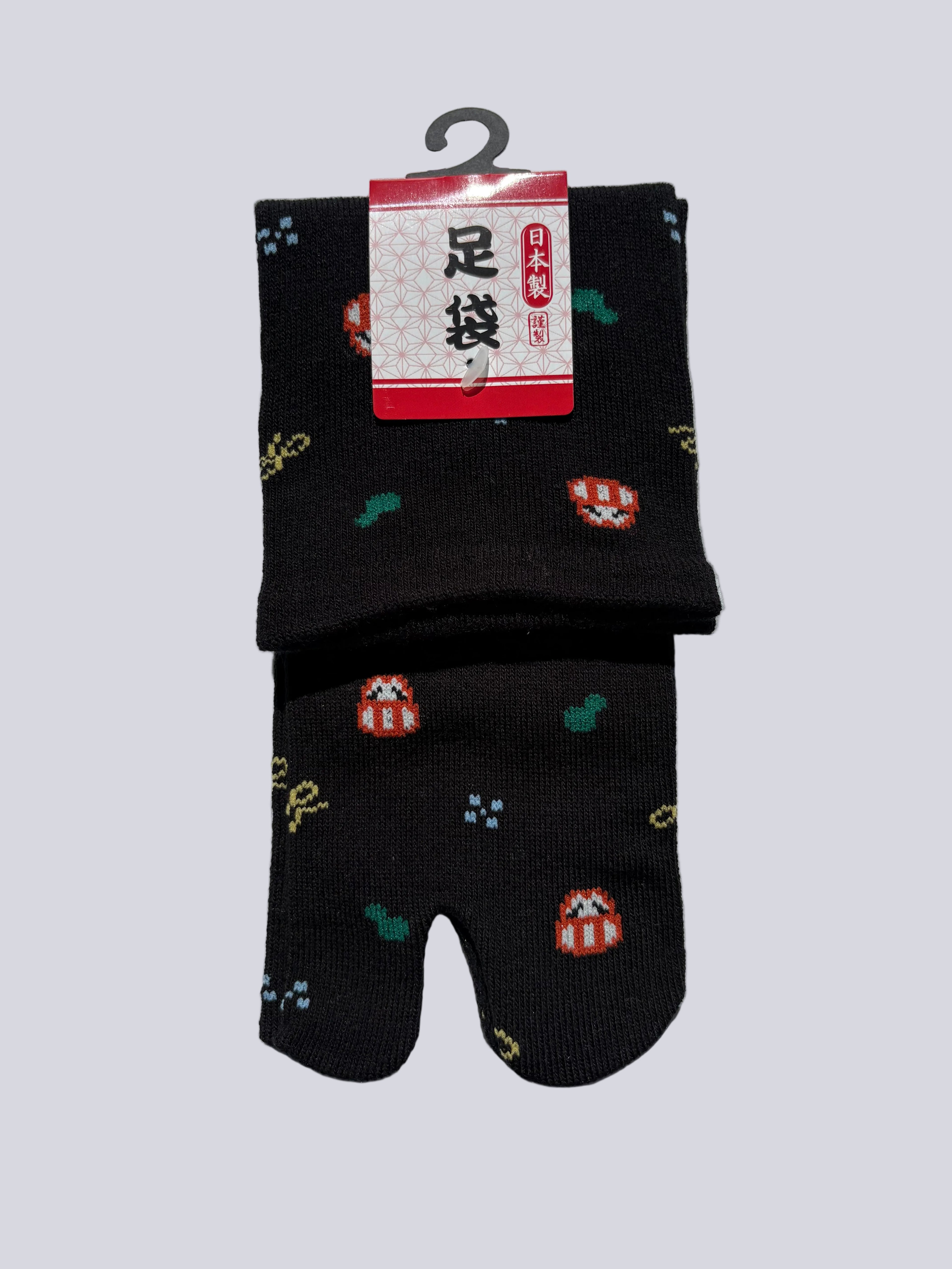 Black tabi split-toe socks with pixel art daruma doll and cactus print — Japanese-made novelty lucky charm tabi socks (足袋)