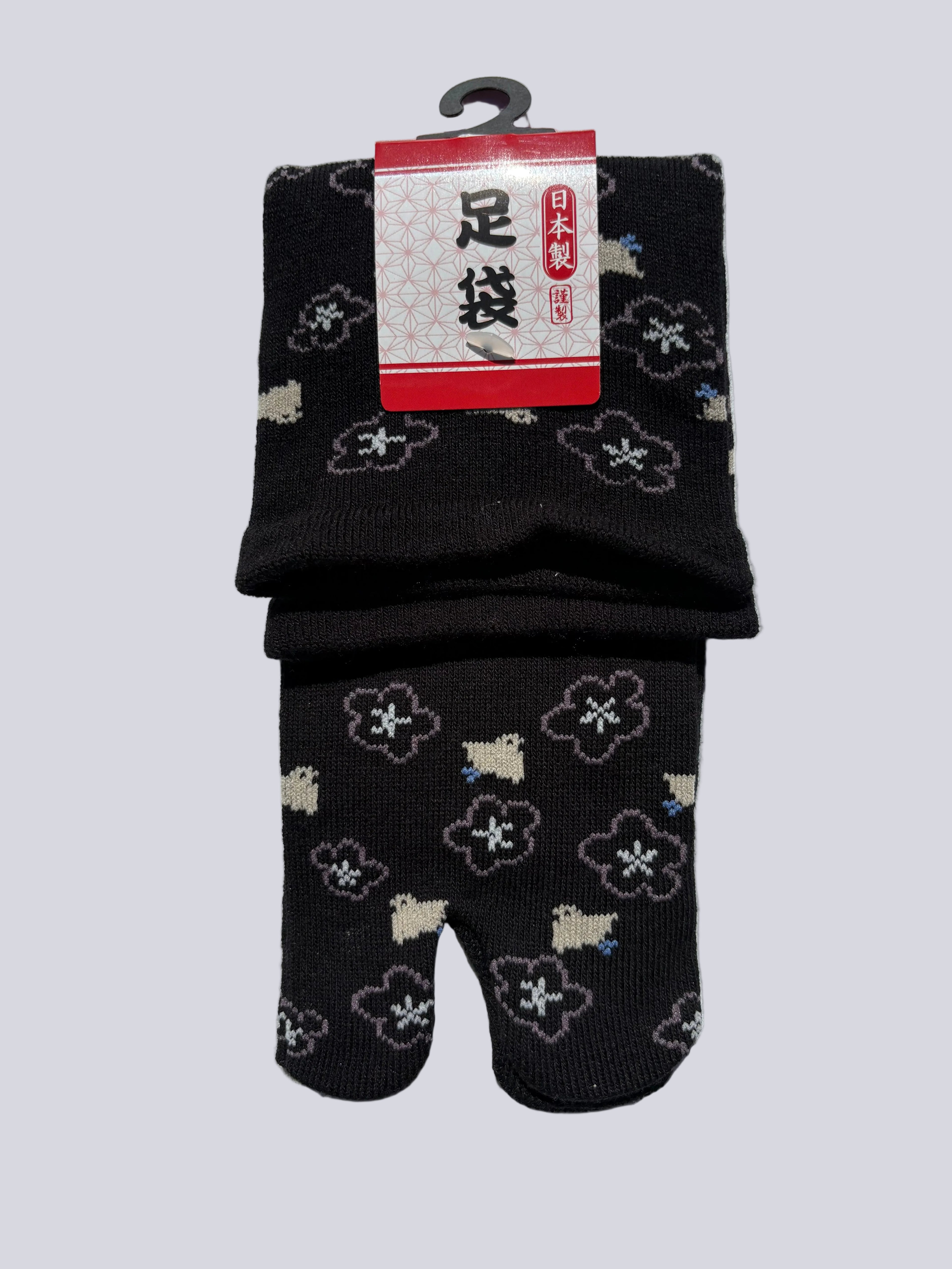 Black tabi split-toe socks with white sakura blossom and blue floral print — Omotenashi Selection Gold Award 2024, Japanese-made loose fit ankle
