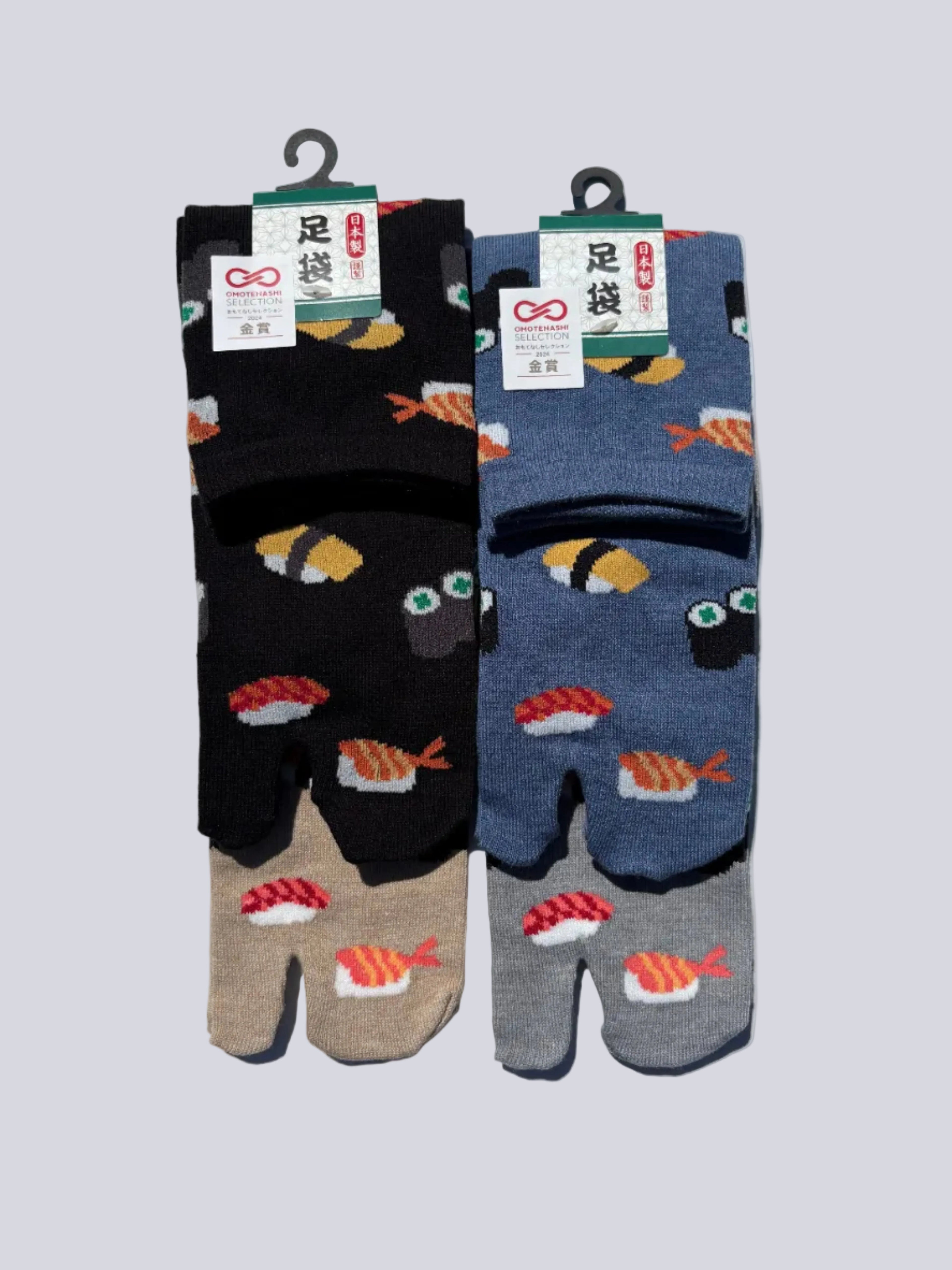pack of four pairs of japanese cotton tabi socks with sushi print design on a white background flat lay