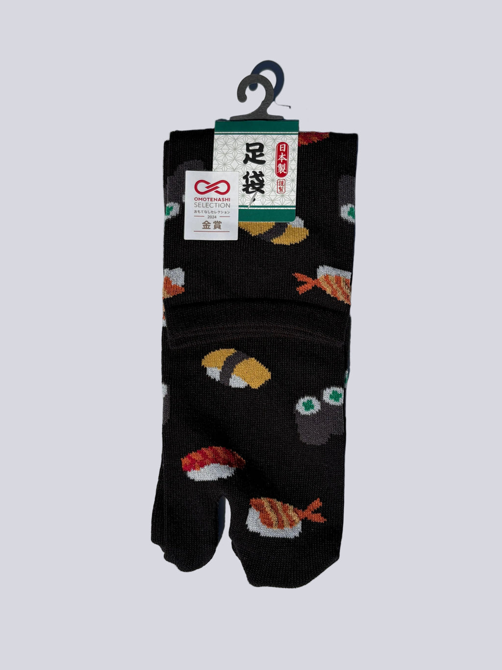 Pack of black japanese cotton tabi socks with sushi print design on a white background flat lay