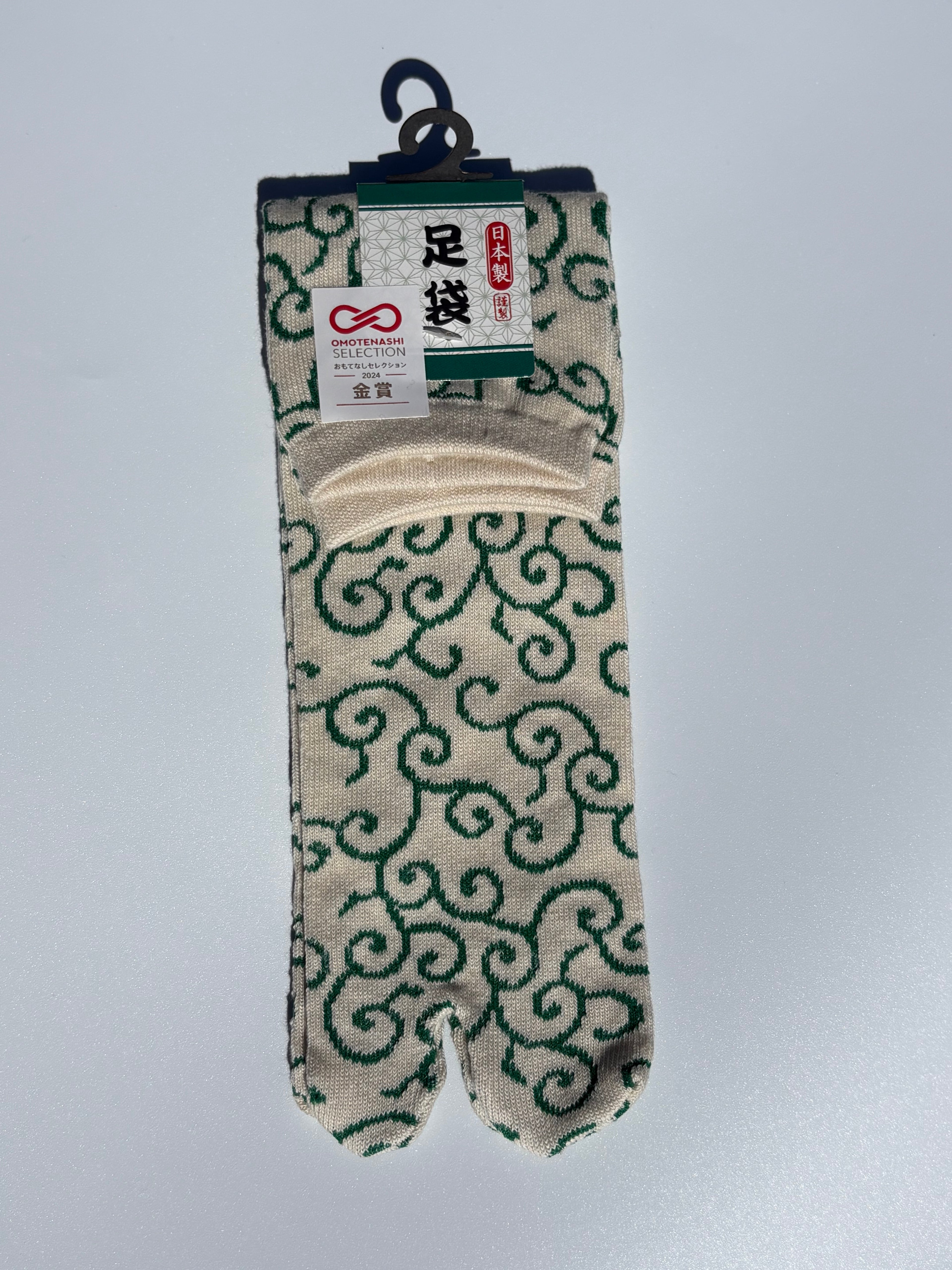white tabi split-toe socks with white karakusa arabesque scroll pattern — Omotenashi Selection Gold Award 2024 Japanese-made tabi socks (足袋)