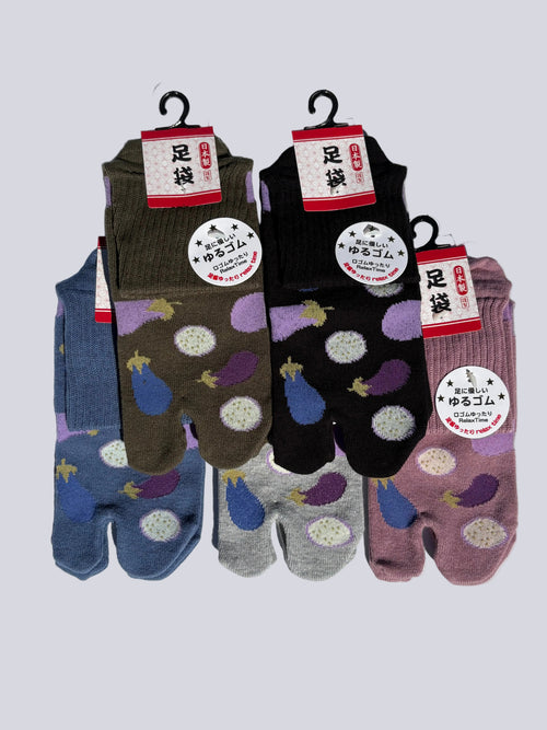five pairs of Japanese tabi split-toe socks with aubergine and turnip vegetable print in blue, olive, black, and mauve — soft elastic relaxed-fit tabi socks made in Japan