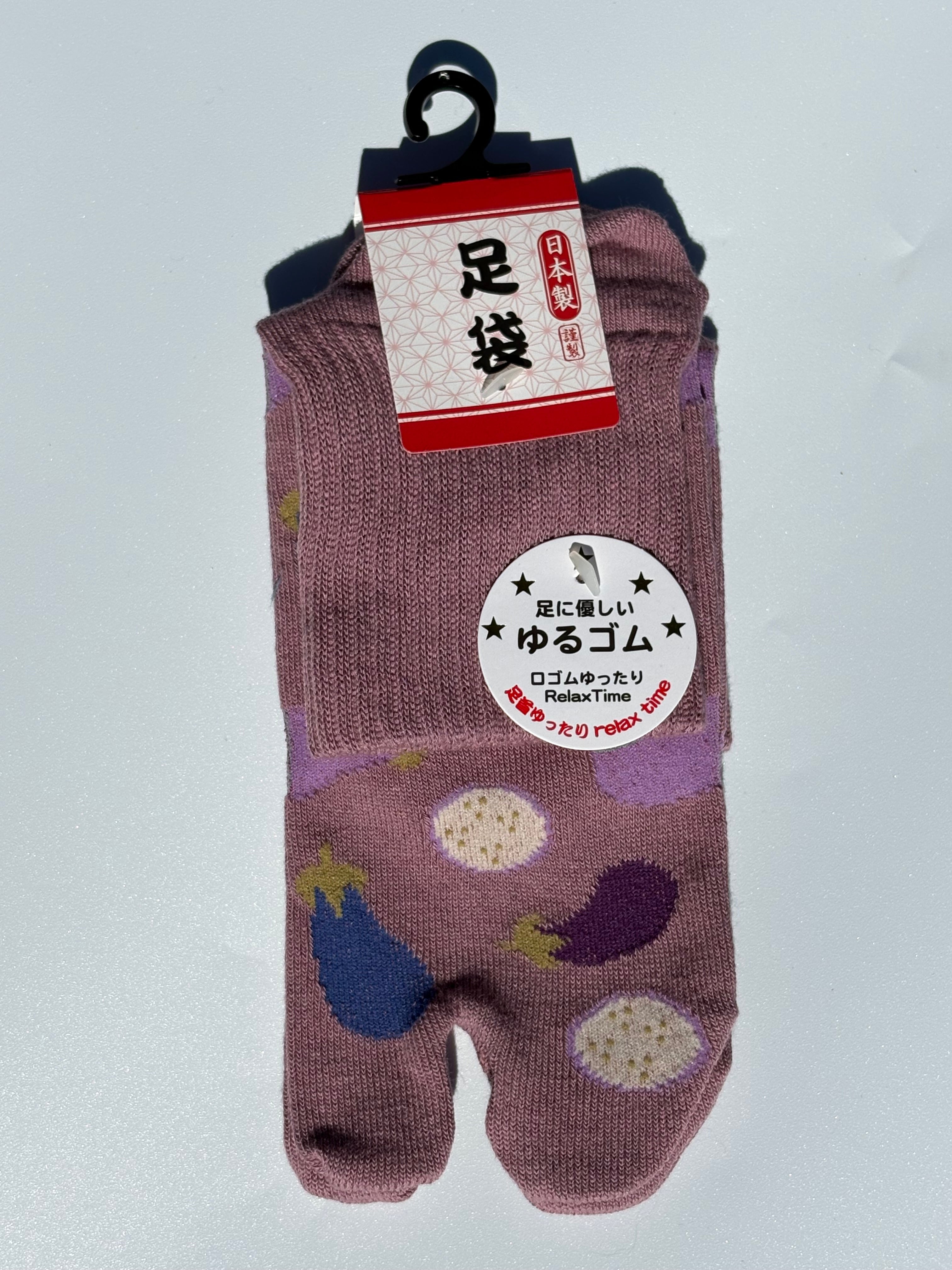 pair of dusty pink Japanese tabi split-toe socks with aubergine and eggplant vegetable print  — soft elastic relaxed-fit tabi socks made in Japan