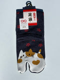 navy tabi split-toe socks with cute kawaii cat face and red snowflake print — Omotenashi Selection Gold Award 2024 Japanese novelty cat tabi socks (足袋)
