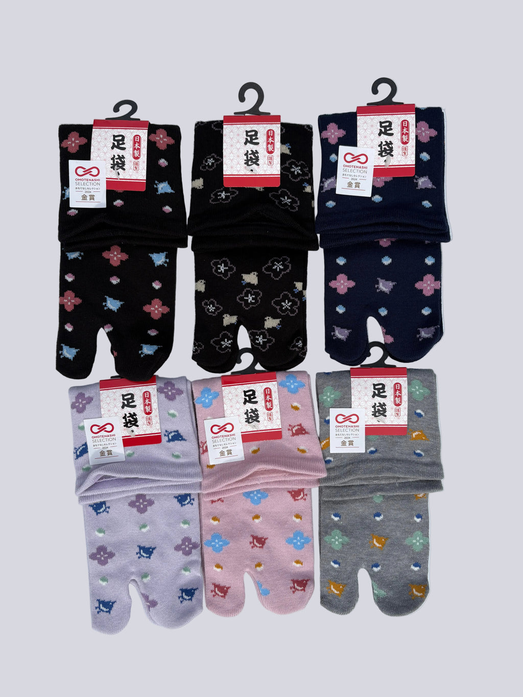 set of size pairs of cotton blend tabi split-toe socks in black, lilac, grey, and pink with birds and floral motif — Japanese-made soft tabi socks size uk 3-6 loose fit ankle cuff