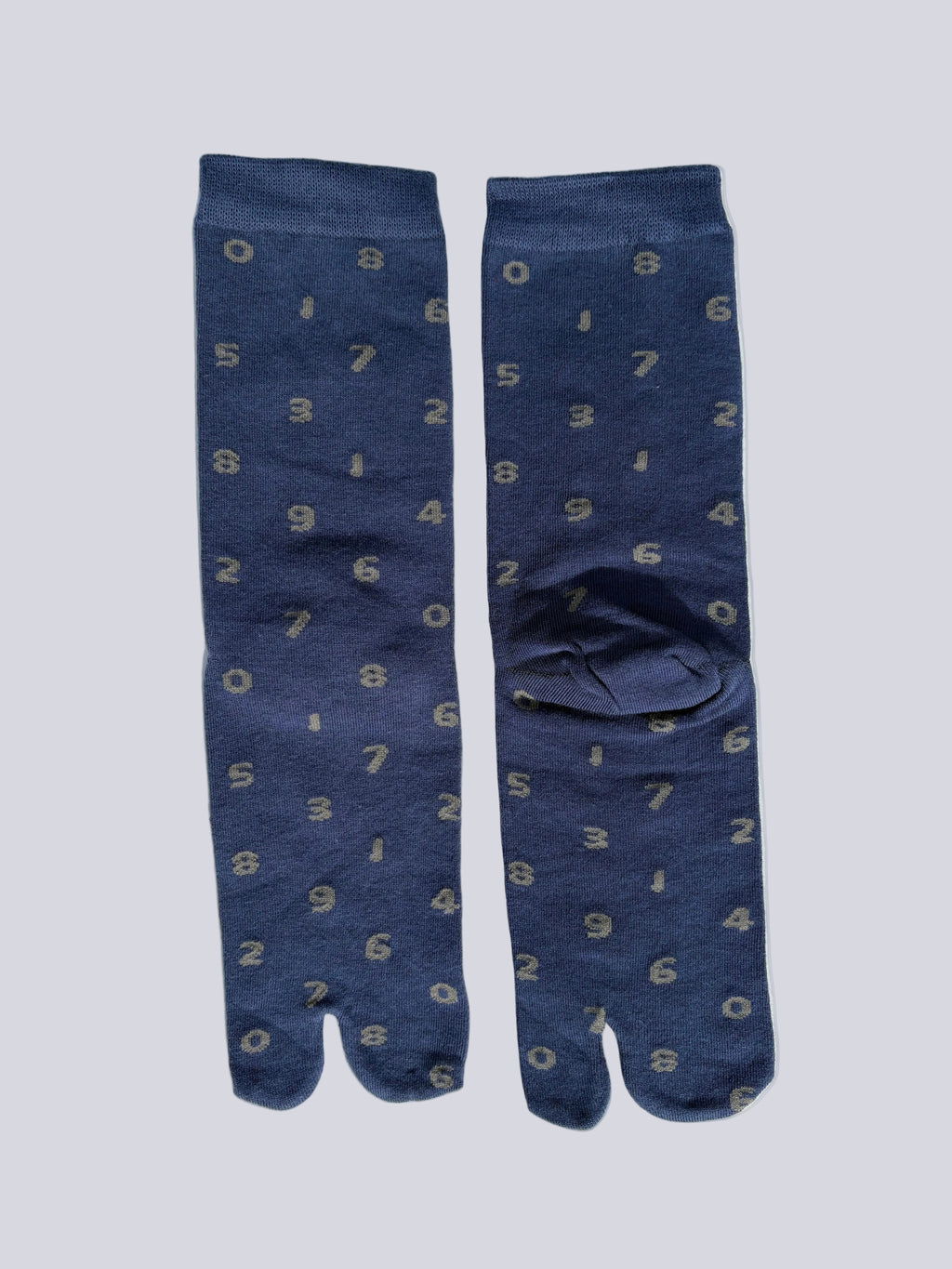 tabi split-toe socks flat lay— blue with grey numbers— novelty Japanese split-toe socks made of cotton