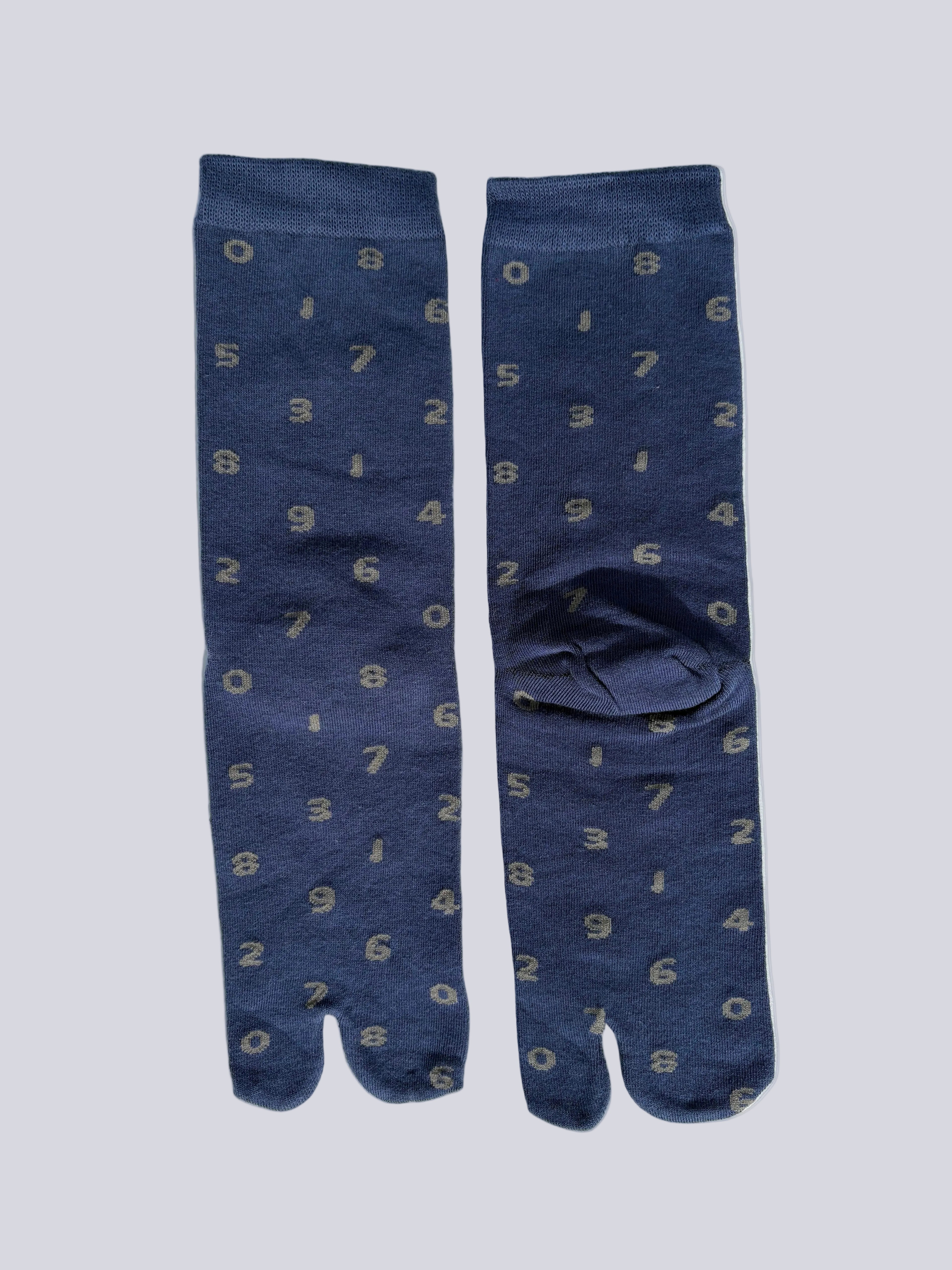 tabi split-toe socks flat lay— blue with grey numbers— novelty Japanese split-toe socks made of cotton