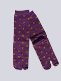 Tabi split-toe socks flat lay— purple with yellow numbers and orange with navy numbers — novelty Japanese split-toe socks made of cotton