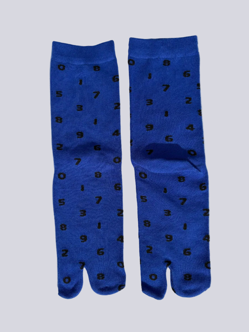 blue tabi socks with black numbers flat lay on a white background made of cotton japanese split toe design