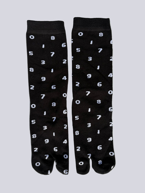 tabi split-toe socks flat lay—black cotton with white numbers — novelty Japanese split-toe socks crew length