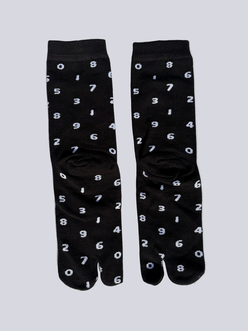 tabi split-toe socks flat lay—black cotton with white numbers — novelty Japanese split-toe socks crew length