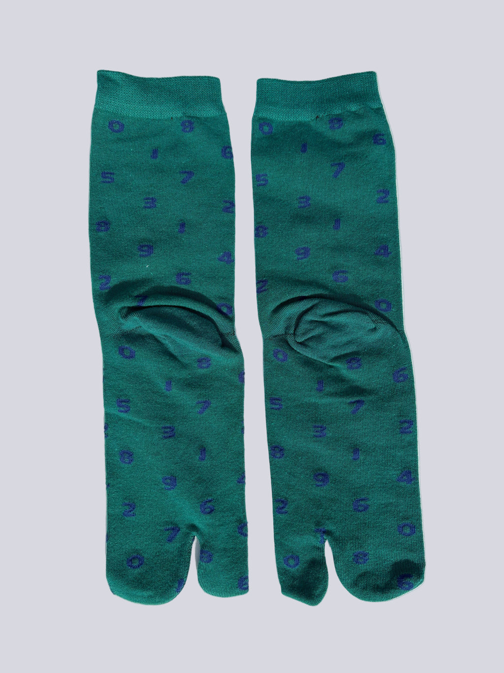 back of green tabi socks with dark blue numbers flat lay on a white background made of cotton japanese split toe design