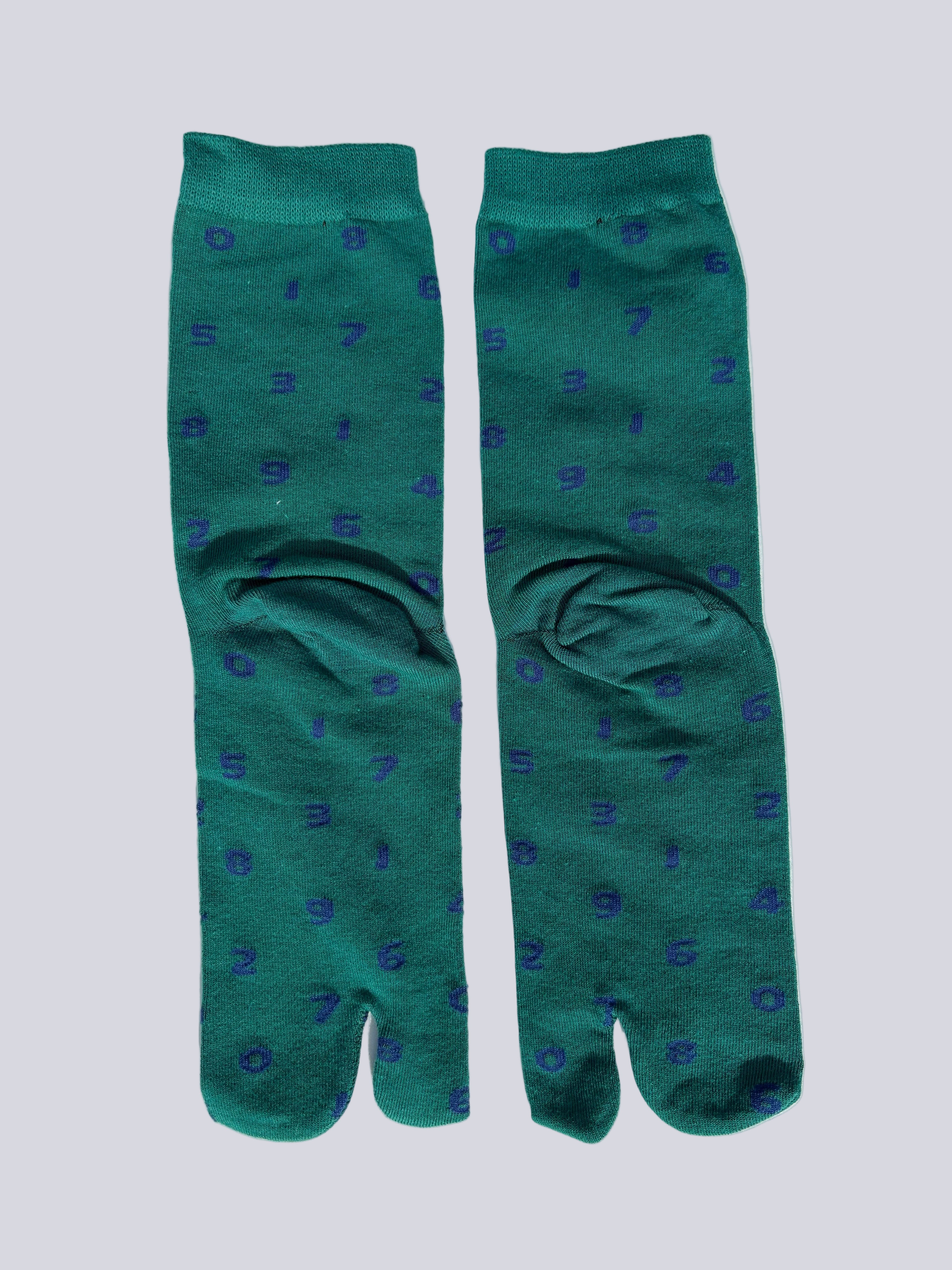 back of green tabi socks with dark blue numbers flat lay on a white background made of cotton japanese split toe design