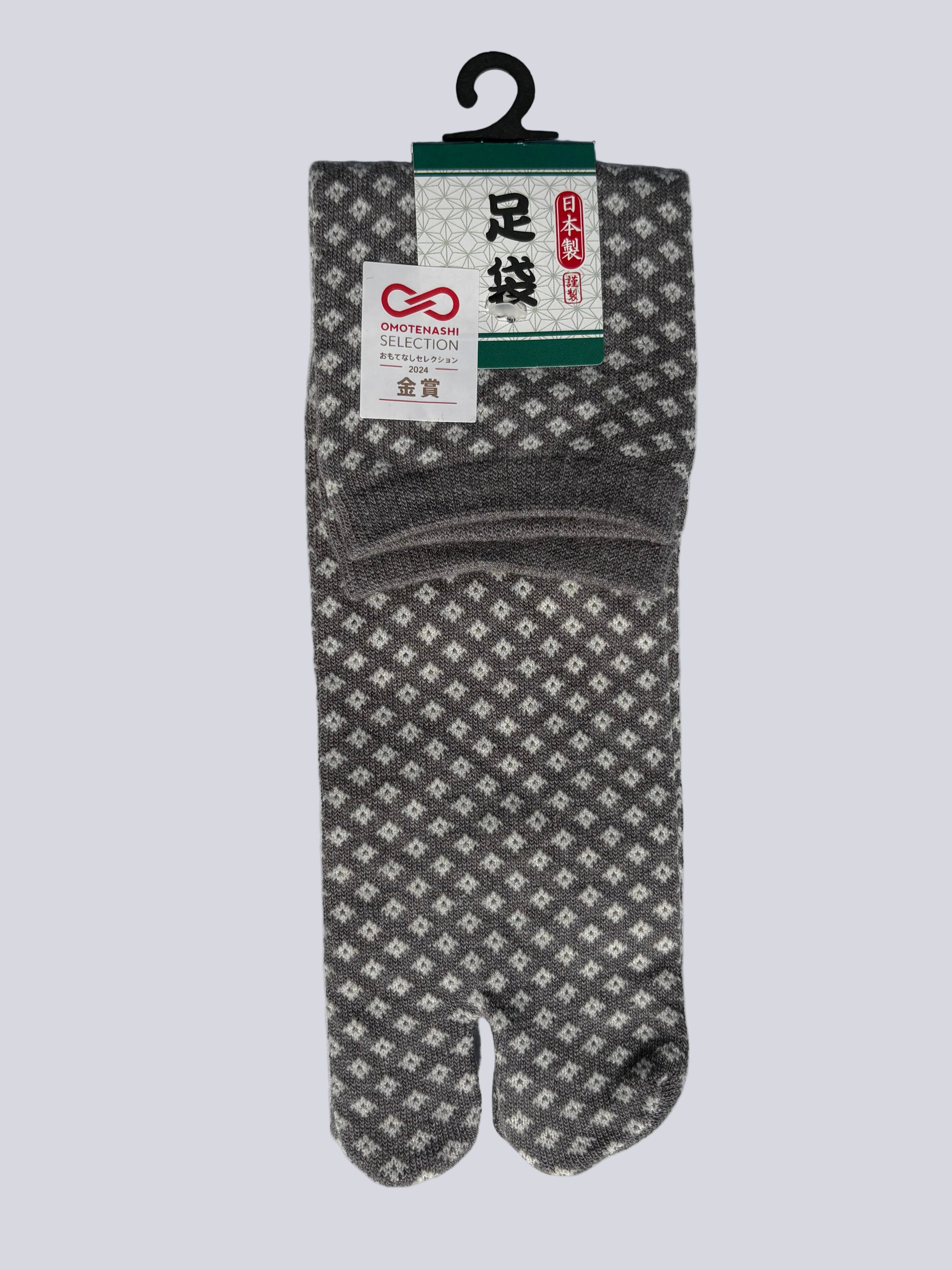 Single pair of tabi split-toe sock toes showing traditional Japanese diamond (hishi) pattern - made in japan