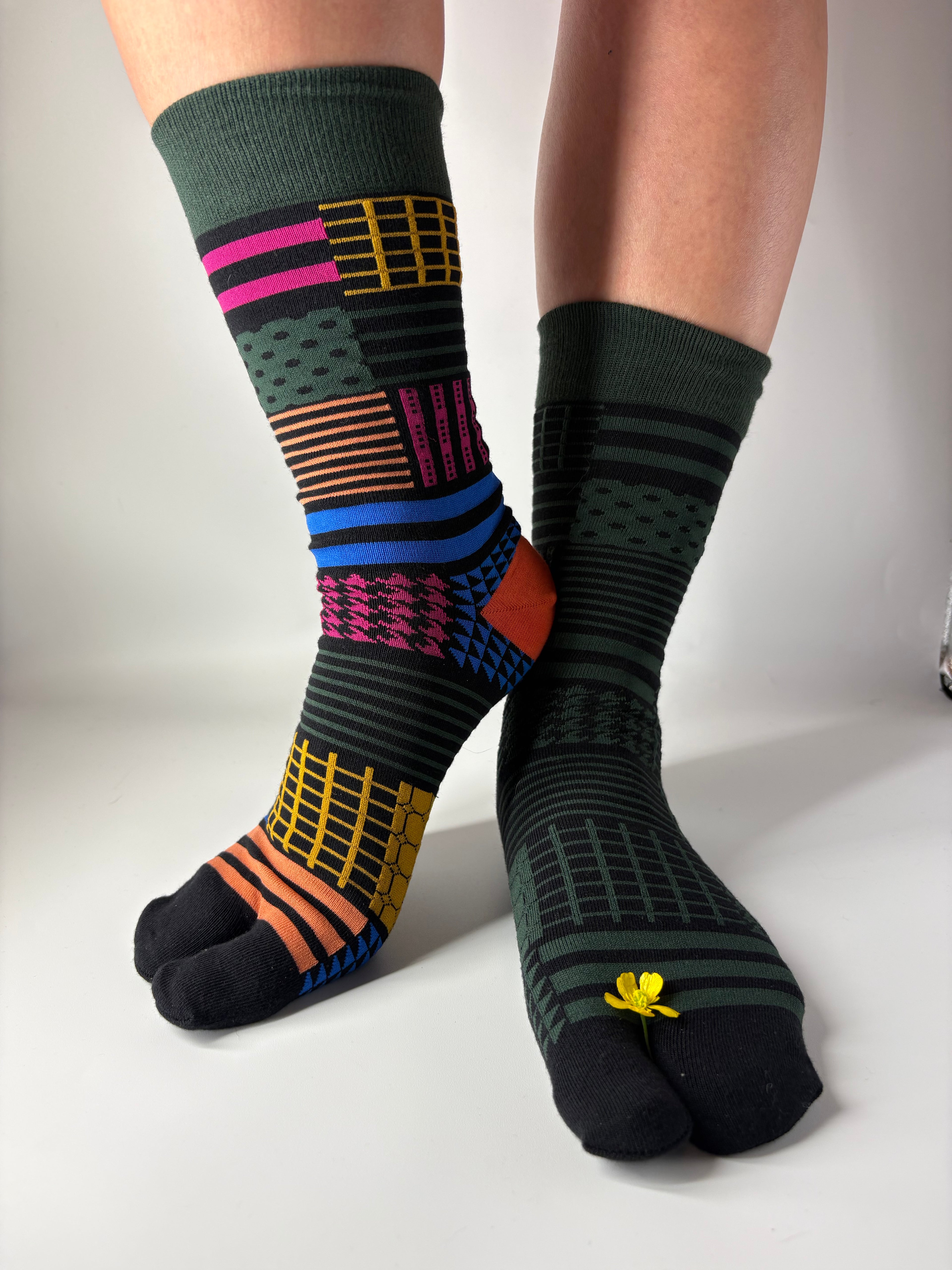 Colorful patterned socks on a plain background
