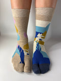 Colorful socks with abstract patterns on a white background