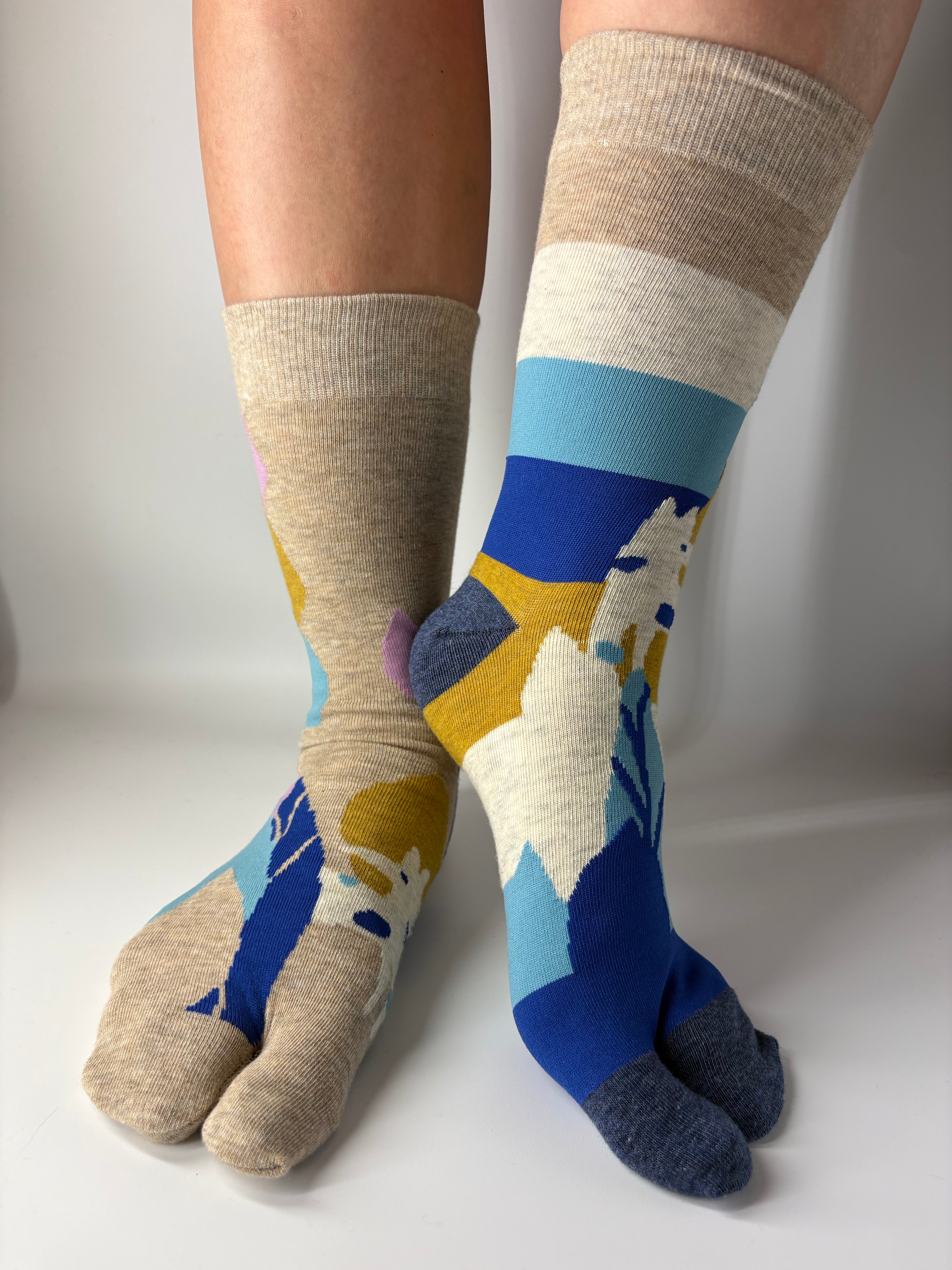 Colorful socks with abstract patterns on a white background