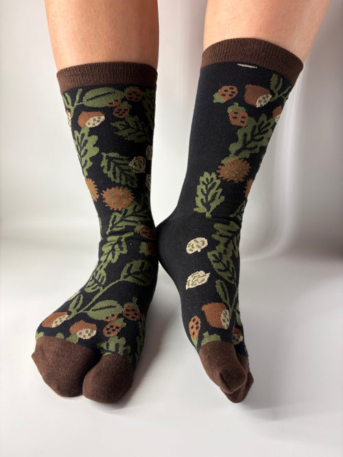 Brown natural botanical earth print socks on a white background with a split toe japanese sock design. Sock is made of cotton natural fibres