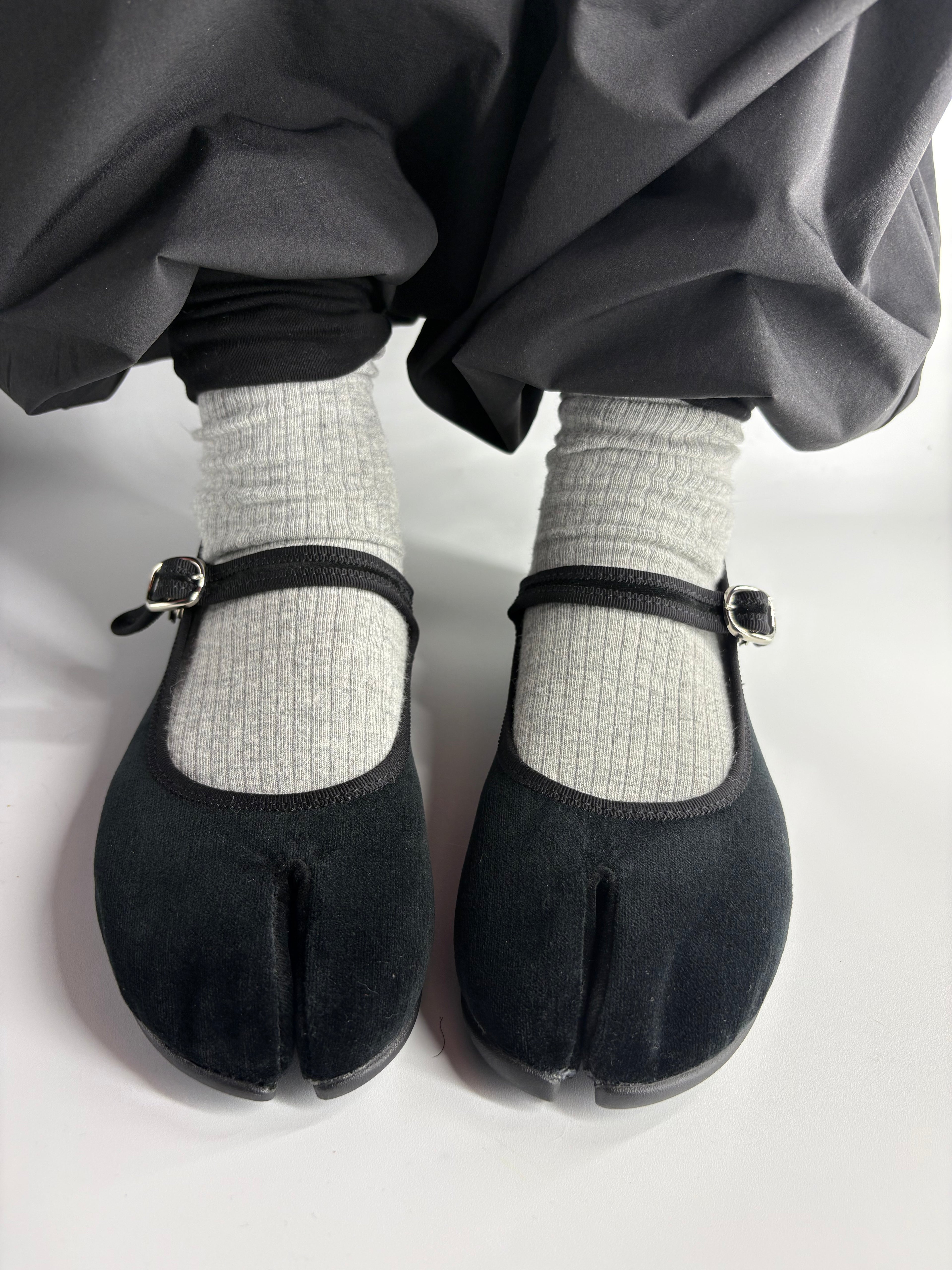 marugo Coppelia Lily black velvet split-toe tabi Mary Jane flats worn with grey socks