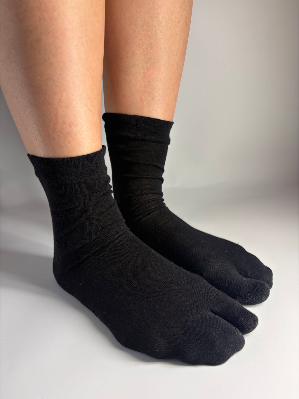 Sheer black silk blend tabi socks with a split-toe design — Tabi Co. UK.