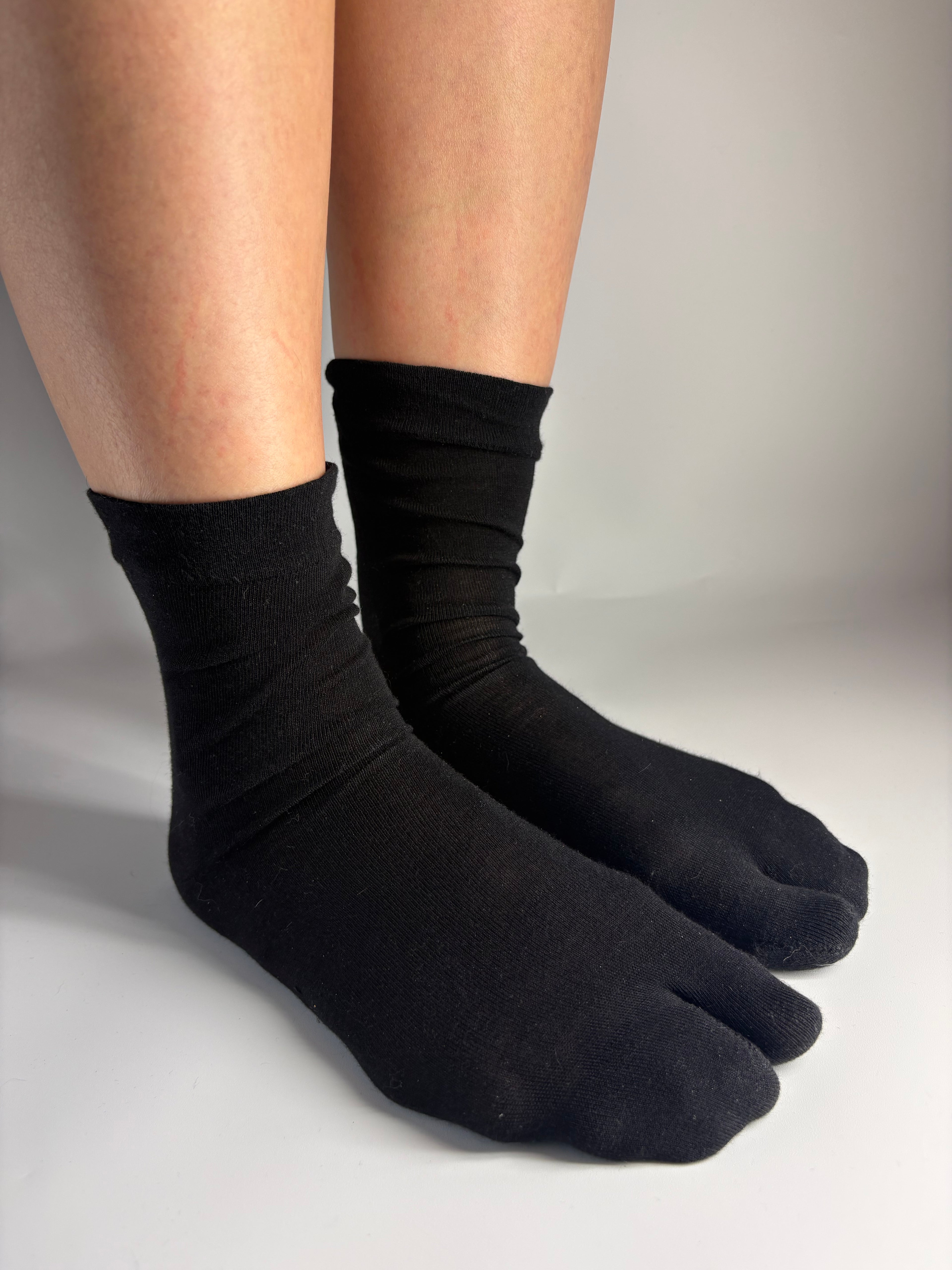 Sheer black silk blend tabi socks with a split-toe design — Tabi Co. UK.