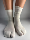 Sheer cream mulberry silk blend split-toe tabi socks in crew length — quiet luxury sock inspiration from Tabi Co.