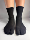 Sheer black mulberry silk blend split-toe tabi socks in crew length — quiet luxury sock inspiration from Tabi Co.