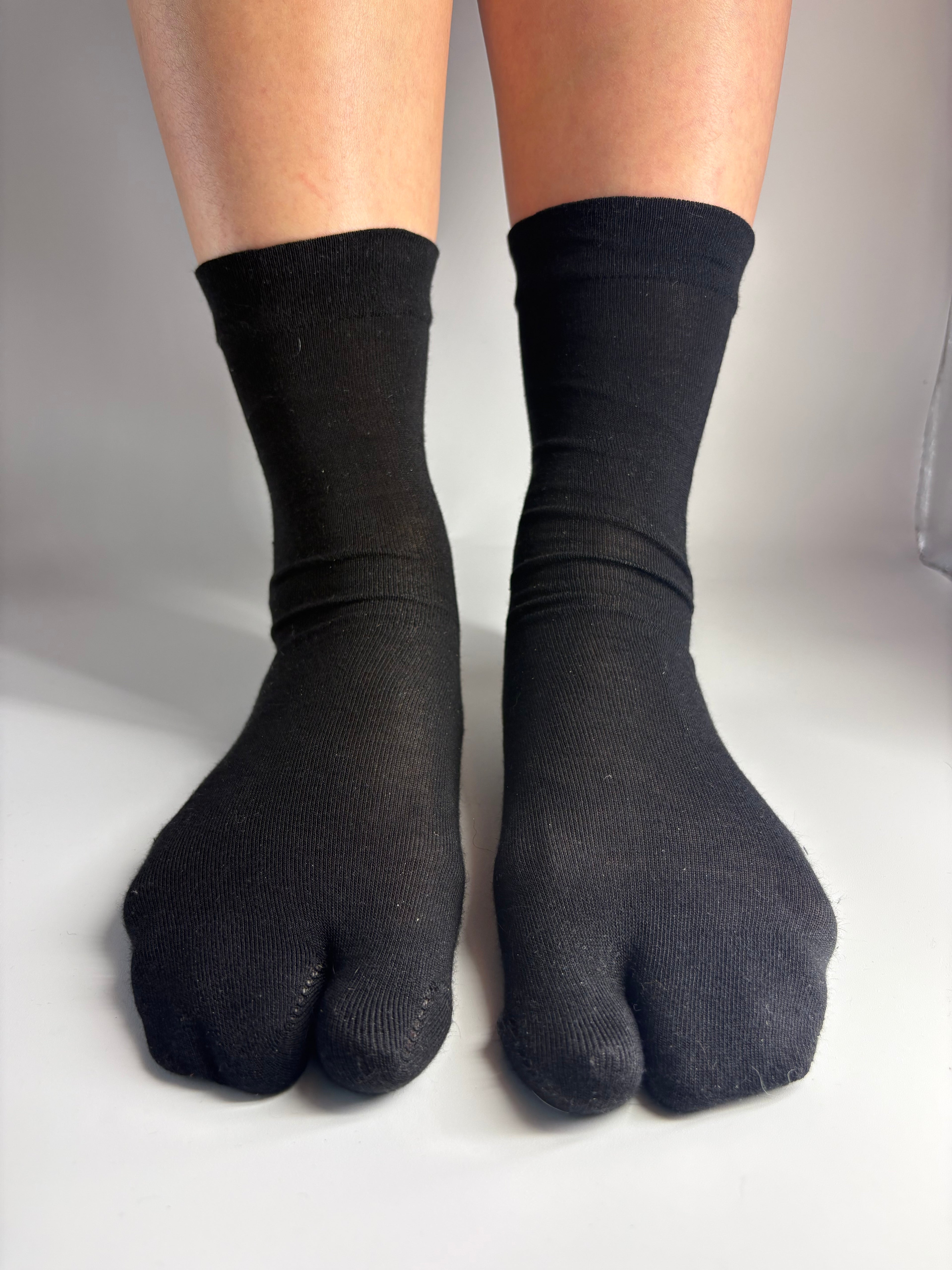 Sheer black mulberry silk blend split-toe tabi socks in crew length — quiet luxury sock inspiration from Tabi Co.